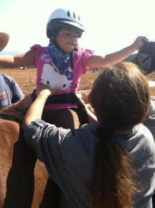 Always cheerful, Corrina gets adjusted for comfort.